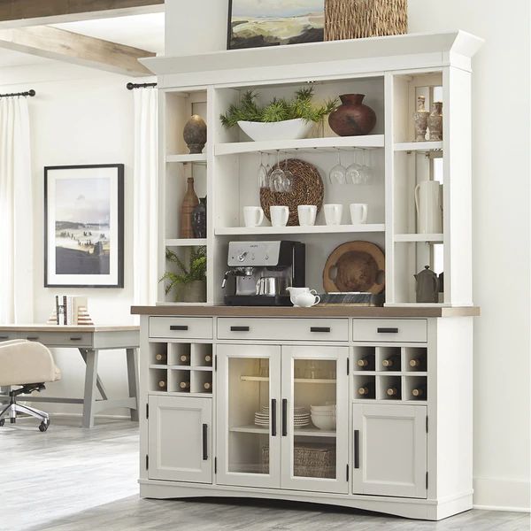 a large white bookcase with glass doors and drawers in the middle of a room