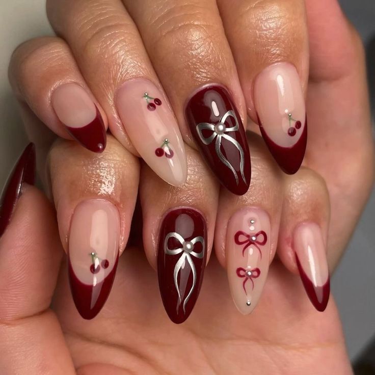 Cherry Mocha Christmas Nails, Cherry Red Nails Christmas, Nail Red Cherry, Maroon Bow Nails, Cherry Art Nails, Cherry Red Nail Ideas, Almond Cherry Red Nails, Nail Inspo Cherry Red, Red And Silver Nails Ideas