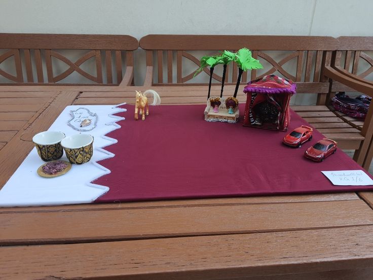 the table is set up with toys and decorations