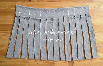 a gray skirt with white arrows on it and the words, we scheden cot all