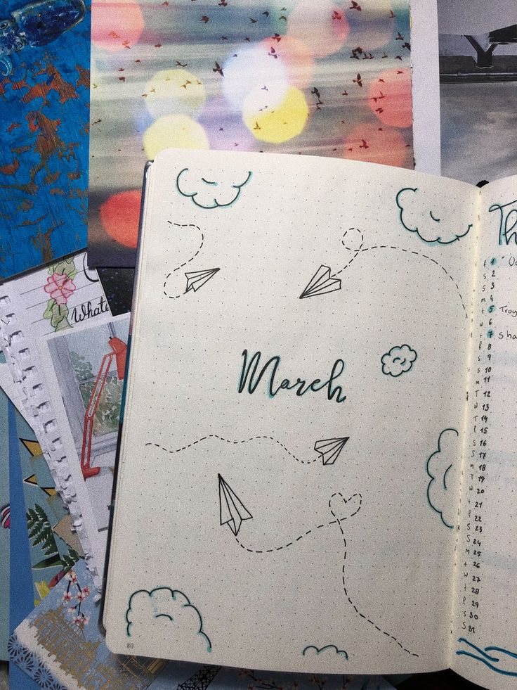 an open notebook with the word march written on it next to various photos and drawings