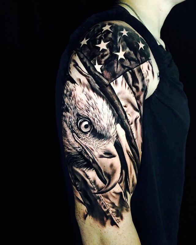 an eagle with the american flag on his arm