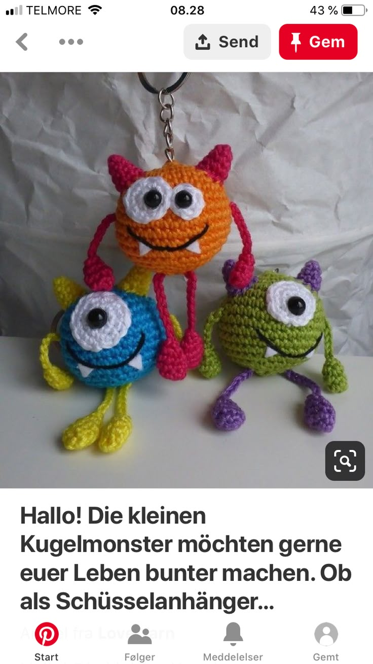 two crocheted stuffed animals with eyes and legs, one is orange the other is green