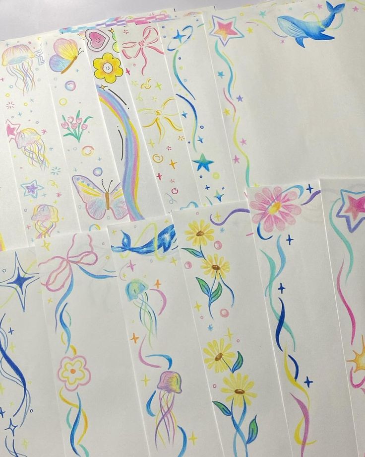 several sheets of paper with different designs and colors on them, all lined up together