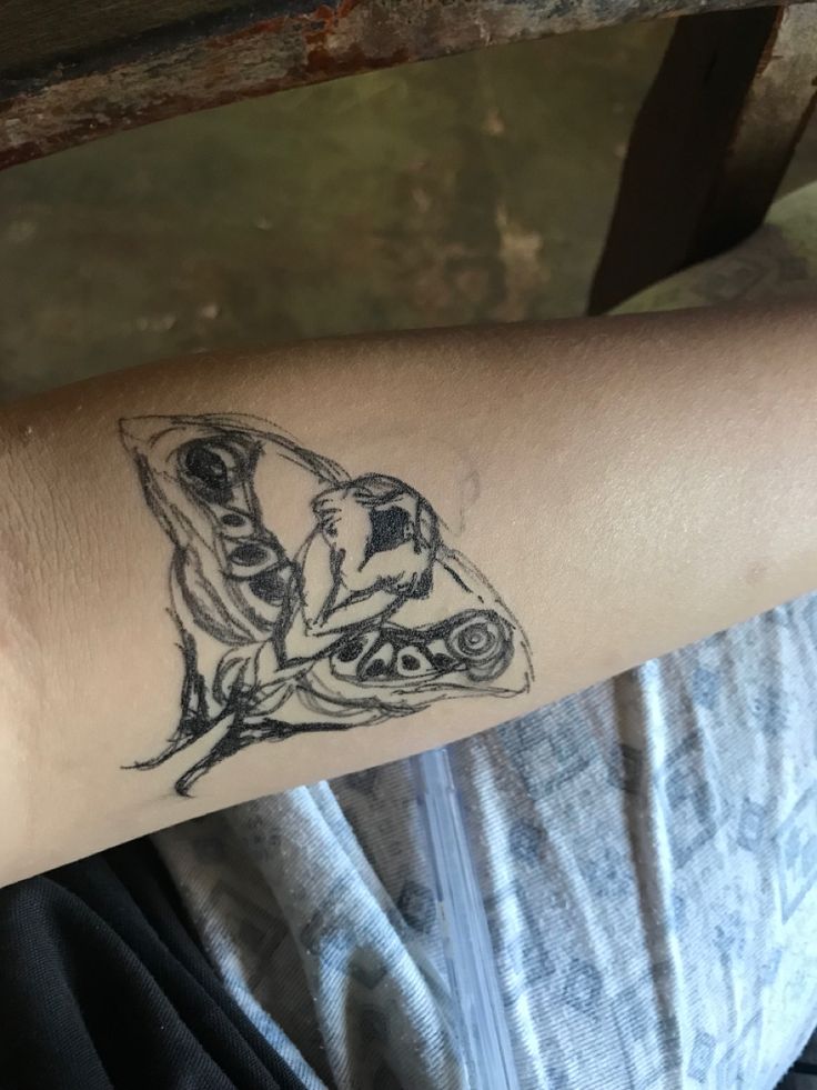 a person with a tattoo on their arm