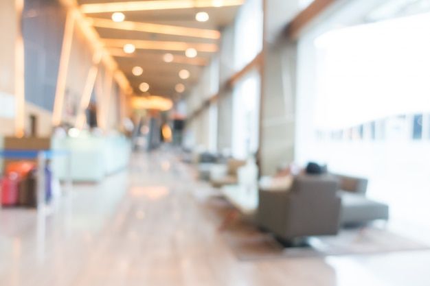 blurry photo of an airport lobby with couches and chairs