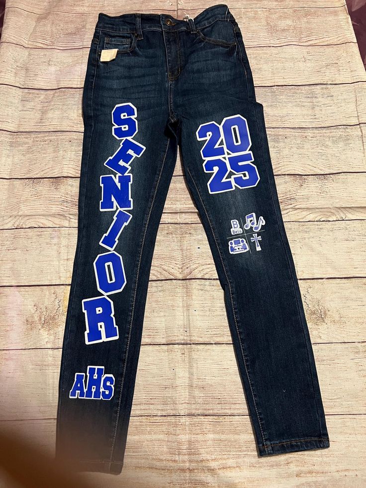 Customized senior jeans.  In your school colors, year of graduation and/or any clubs/organizations.   you can also supply your own jeans - $50 send note to seller. Homecoming Jeans Decorated, Senior Pants High Schools, Homecoming Jeans, Senior Painted Jeans, Senior Pants, Spirit Jeans, Senior Things, 50 Sent, Senior Jeans