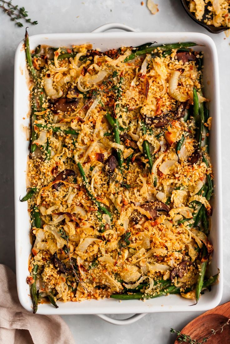 a casserole dish filled with green beans and rice