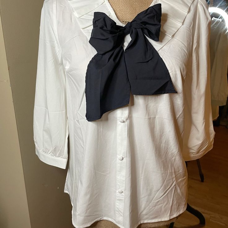 Cute Milk & Honey Bow Tie Blouse In Black And White. Bow Can Be Untied To Tie However Suits The Outfit. 3/4 Length Sleeve And Flowy Unstructured Fit. Never Worn Great Condition White 3/4 Sleeve Blouse For Work, Chic White Blouse With Bow Detail, Chic White Blouse With Bow, White Half Sleeve Office Blouse, White Half Sleeve Blouse For Office, Elegant Half Sleeve Blouse For Daywear, Elegant White Half Sleeve Blouse, White Bow Blouse For Workwear, Spring Office Wear Blouse With Bow