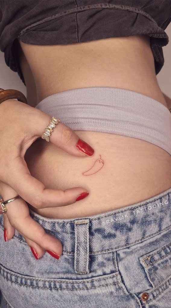 a woman's stomach with her hand on the belly and red nails painted on it