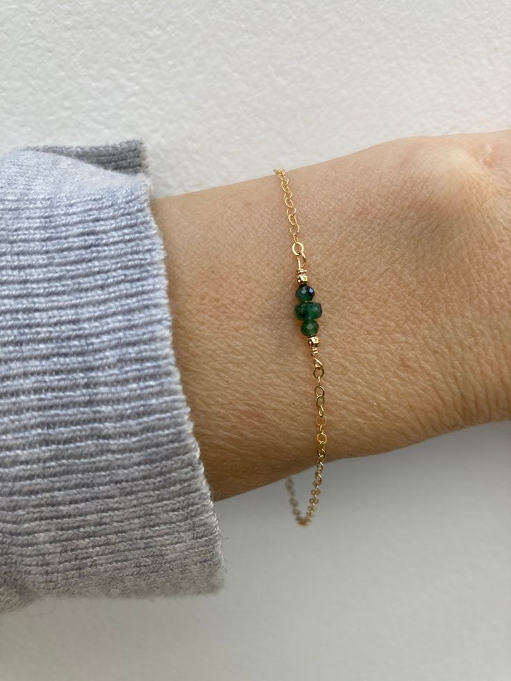 "Before placing an order please check the estimated shipping times. If you need your order in a hurry shipping upgrades are available.  Thank you. This little bracelet made with high quality materials makes a great gift. Emerald is also the birthstone of anyone born in the month of May. D E T A I L S  *It features top quality emerald rondelles from India. They are very nicely cut for maximum sparkle. *on a sparkly 14k gold filled chain. Sterling silver are also available. *Gold filled is a wonde Dainty Bracelets With May Birthstone For Everyday, Hypoallergenic May Birthstone Bracelet For Birthday, Hypoallergenic Bracelets For May Birthstone Birthday Gift, Delicate Beaded Bracelets With Birthstone As Gift, Dainty Beaded Bracelets For Birthday, Delicate Green Bracelet As Gift, Minimalist Green Bracelet For Gift, Stackable Bracelets As May Birthstone Gift, Handmade Everyday Bracelets For May Birthstone