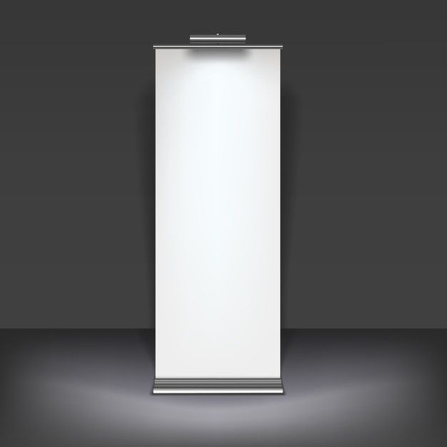 an empty white roll up banner stand on a dark background with light coming from behind it