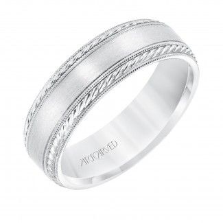 a white gold wedding ring with engraved details