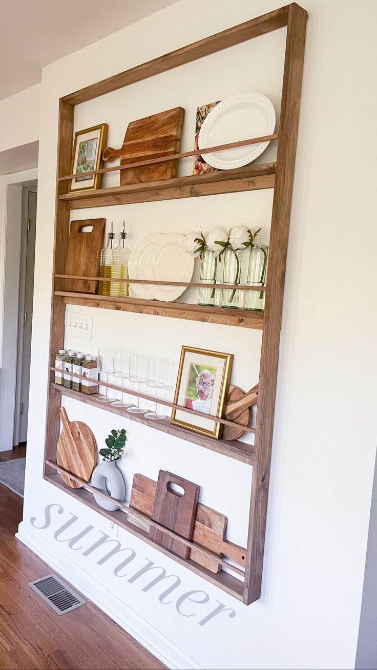 the shelves are filled with kitchen items and plates on top of them, along with other things