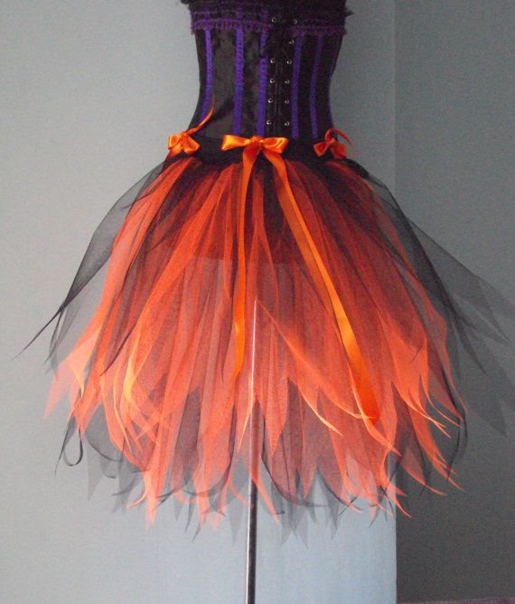 an orange and purple dress on a mannequin