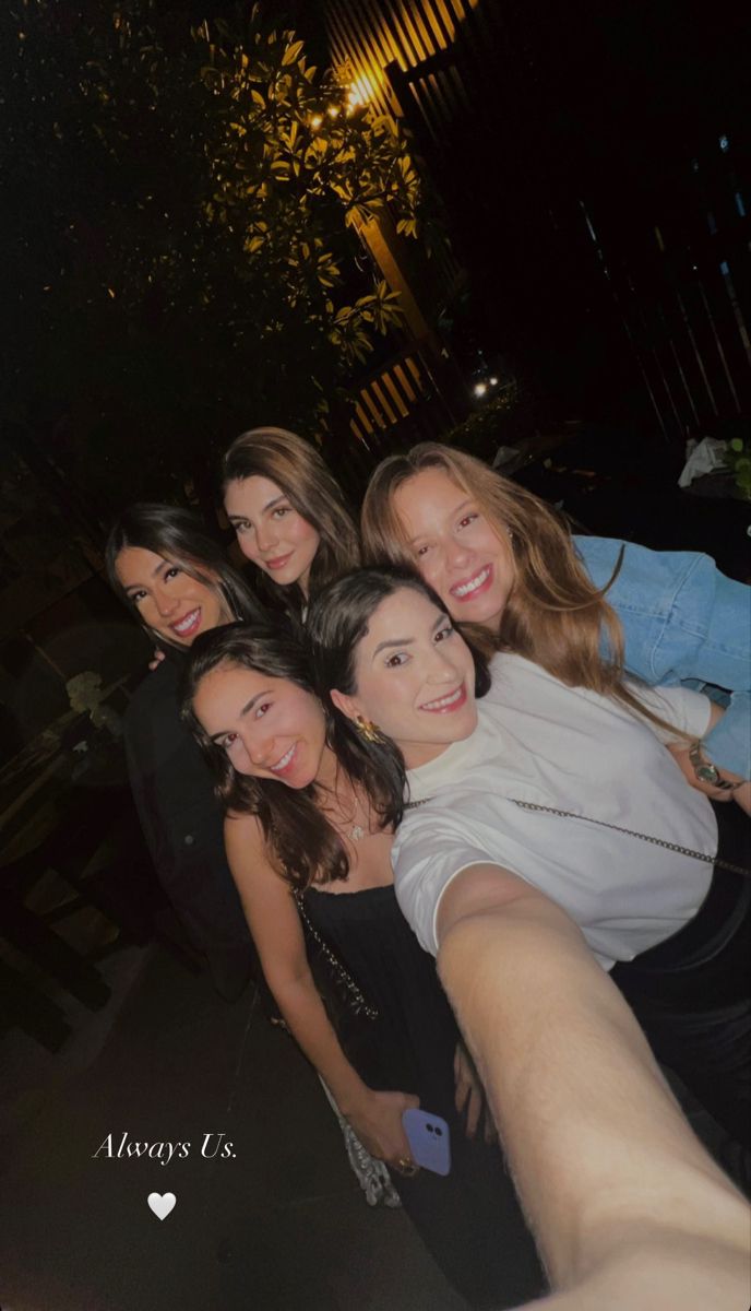 a group of young women taking a selfie