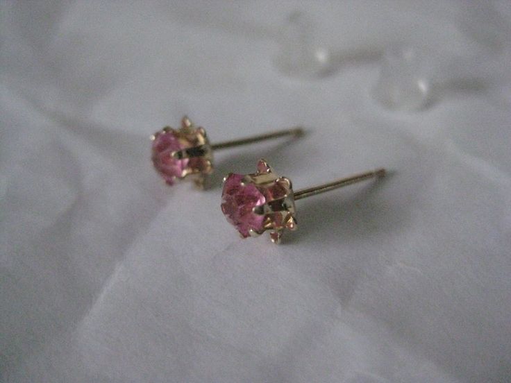 14K Pink Stone Stud Yellow Gold Earrings Vintage Karat KT Solid Pierced Post Materials: 14K solid gold metal marked (14K), (pink stones - do not know what they are made from) with plastic/silicone post backs Condition: excellent vintage Measures - 5mm x 5mm x 4mm Maker's mark - P Questions welcome. Pink 14k Gold Wedding Earrings, Pink Earrings With Prong Setting For Anniversary, Pink Prong Set Earrings For Anniversary, Pink Wedding Earrings With Birthstone, Fine Jewelry Hallmarked Pink Earrings, Pink Hallmarked Fine Jewelry Earrings, Hallmarked Pink Fine Jewelry Earrings, Pink Round Birthstone Earrings, Pink Birthstone Round Earrings