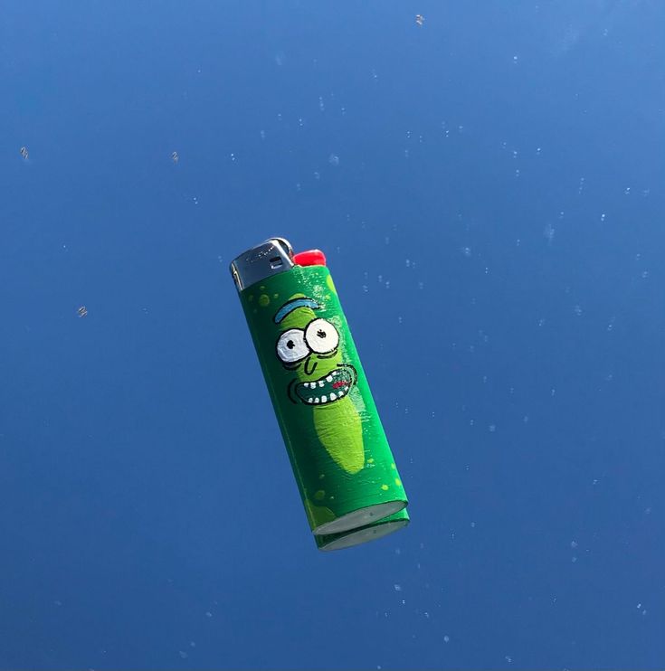 a green tube shaped like a cartoon character flying through the air