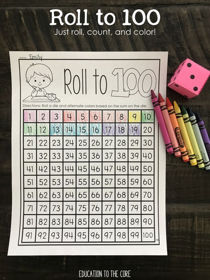 a roll to 100 game with crayons and markers on the table next to it