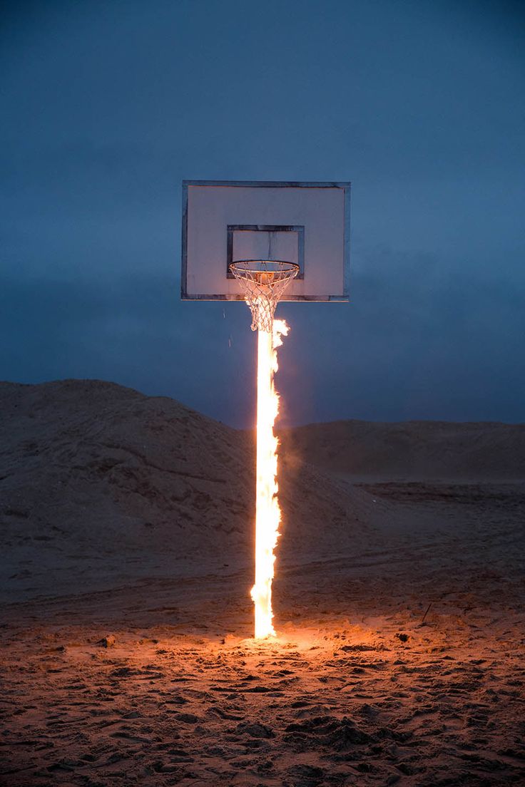 a basketball hoop with fire coming out of it