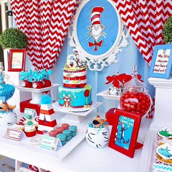 the cat in the hat themed birthday party is ready for guests to eat and drink