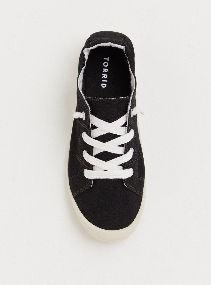 Our Riley Ruched Sneaker features a stretchy back that adds effortless functionality to a lace-up shoe that pairs easily with pants and skirts. Our unique fit gives you extra wide width and extra room around your whole foot. EXTRA WIDE WIDTH (WW). Lace-up. Back elastic ruching for added comfort and easy dress. Extra padded footbed; rubber sole. Man-made materials . Imported extra wide width shoes. The best plus size women's riley ruched sneaker (ww) sneakers in black made of canvas. Rock your look from Torrid to Festivals like Coachella and Lollapalooza, a concert, a show, or just for fun! You'll want to wear these basics every day. Casual Stretch Lace-up Sneakers, Black Lace-up Canvas Shoes With Rubber Waffle Outsoles, Casual Black Sneakers With Lace-up Fastening, Black Low-top Running Shoes With Breathable Fabric, Black Casual Sneakers With Lace-up Fastening, Black Non-slip Low-top Canvas Shoes, Lightweight Non-slip Black Sneakers, Black Medium Width Low-top Sneakers, Easy Dress