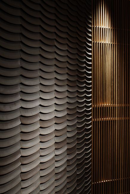 the wall is made up of wavy shapes