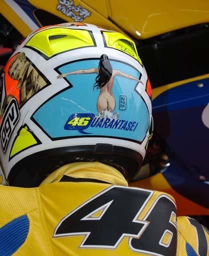 a person wearing a yellow and blue motorcycle helmet