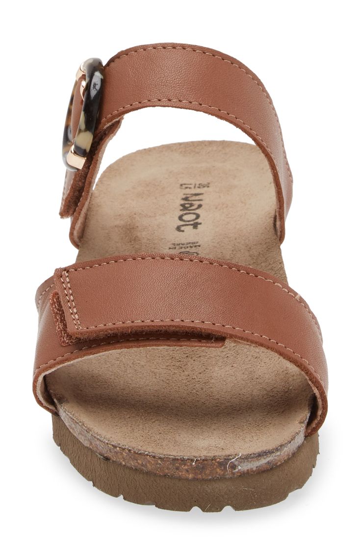 A rounded buckle stands out at the strap of a summery sandal set on a walkable wedge for everyday comfort and style. 1 1/4" heel (size 39) Adjustable hook-and-loop straps Cushioned footbed with arch support Leather upper and lining/synthetic sole Imported Brown Slingback Sandals With Buckle And Round Toe, Brown Wedge Sandals With Buckle Closure And Round Toe, Brown Round Toe Wedge Sandals With Buckle, Brown Slingback Footbed Sandals With Buckle Closure, Casual Brown Slingback Footbed Sandals, Wedge Heel Sandals With Buckle Closure, Adjustable Brown Wedge Heel Sandals, Brown Ankle Strap Wedge Sandals With Leather Footbed, Brown Slingback Footbed Sandals With Adjustable Strap