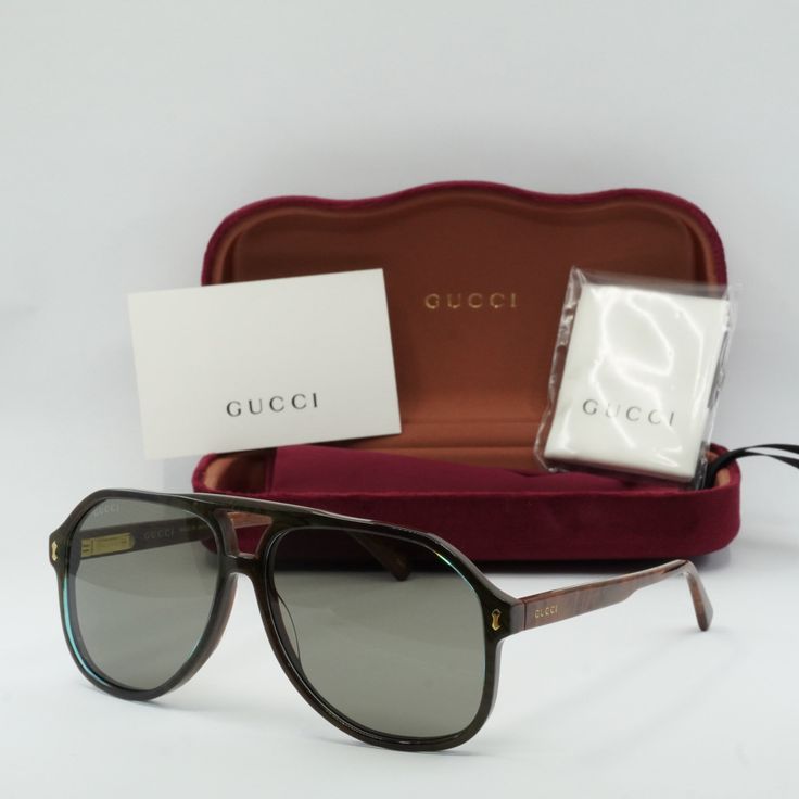 Welcome to OSSA FRAMES, your one-stop destination for luxury eyewear! Introducing the Gucci GG1042S 003 Blue/Brown/Grey aviator sunglasses, the epitome of style and sophistication for the modern man. Crafted by the renowned Italian fashion house Gucci, these sunglasses exude effortless elegance with their sleek design and high-quality materials. The frame color in an exquisite shade of blue perfectly complements the cool grey lenses, creating a striking contrast that is sure to turn heads wherever you go. The acetate frame material ensures durability and comfort, while the 60mm lens socket width provides ample coverage for optimal sun protection. With a temple length of 145mm and a bridge size of 13mm, these sunglasses are designed to fit comfortably on a variety of face shapes and sizes. Luxury Brown Shield Sunglasses With Gradient Lenses, Designer Brown Shield Sunglasses With Polarized Lenses, Designer Brown Shield Sunglasses With Gradient Lenses, Luxury Brown Shield Sunglasses With Polarized Lenses, Designer Brown Shield Sunglasses With Tinted Lenses, Designer Brown Sunglasses With Mirrored Lenses, Designer Brown Sunglasses With Uv Protection, Designer Brown Sunglasses With Polarized Lenses, Designer Brown Tinted Sunglasses