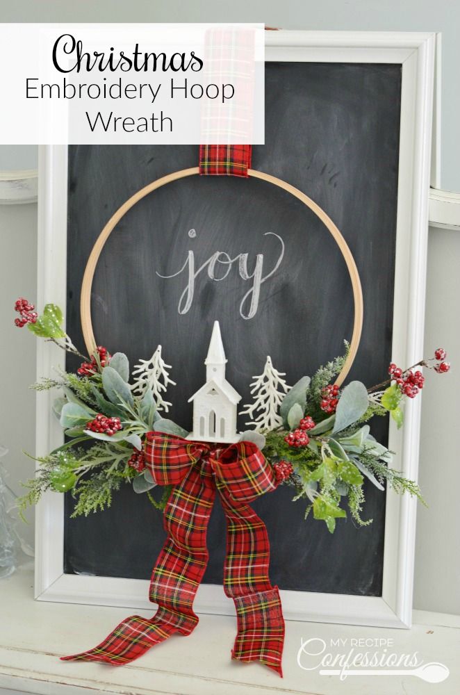 christmas embroidery hoop wreath with the word joy written on it