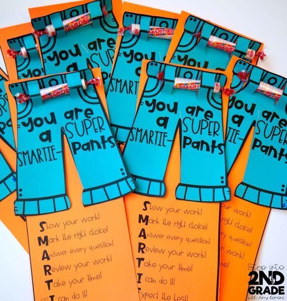 some blue and orange paper tags with words on them