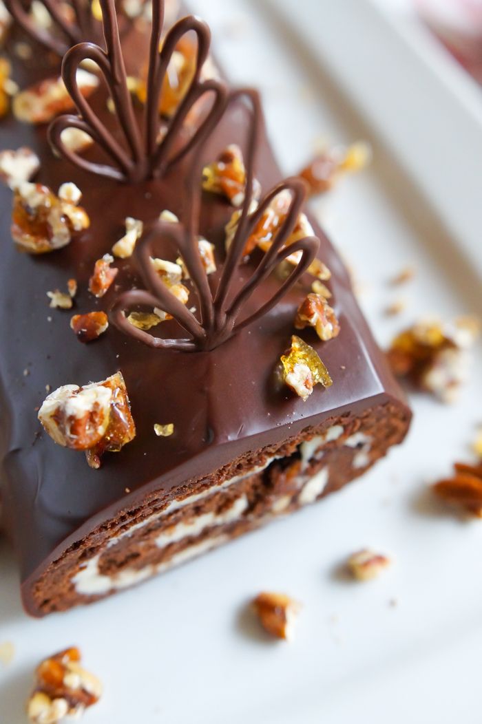 there is a piece of chocolate cake with nuts on it