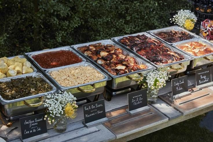 several trays of food sitting on top of a table