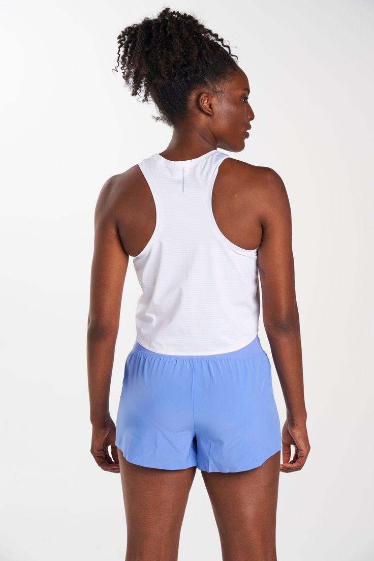 The ALRN Crop Mesh Singlet is perfect for running or yoga. The Birdseye knit is ultralight and allows for superb breathability. The crop length and armhole shapes are flattering and shaped for maximum movement. This tank is style in motion. 4-way Stretch Activewear For Running, White 4-way Stretch Activewear For Workout, High Stretch Racerback Activewear For Running, Breathable Stretch Tank Top For Athleisure, Breathable Stretch Athleisure Tank Top, White 4-way Stretch Go-dry Activewear, White Go-dry 4-way Stretch Activewear, Go-dry 4-way Stretch Racerback Activewear, Athleisure Moisture-wicking Crop Top For Sports