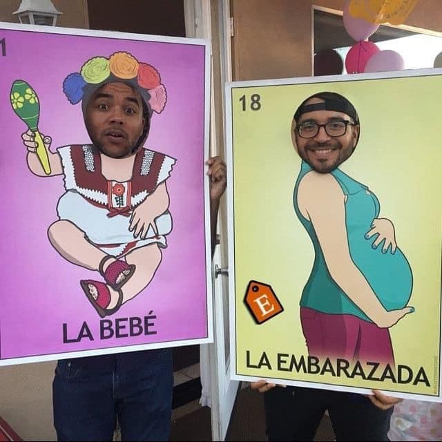 two people holding up posters in front of their faces and the words la bebe, la embarzada written on them