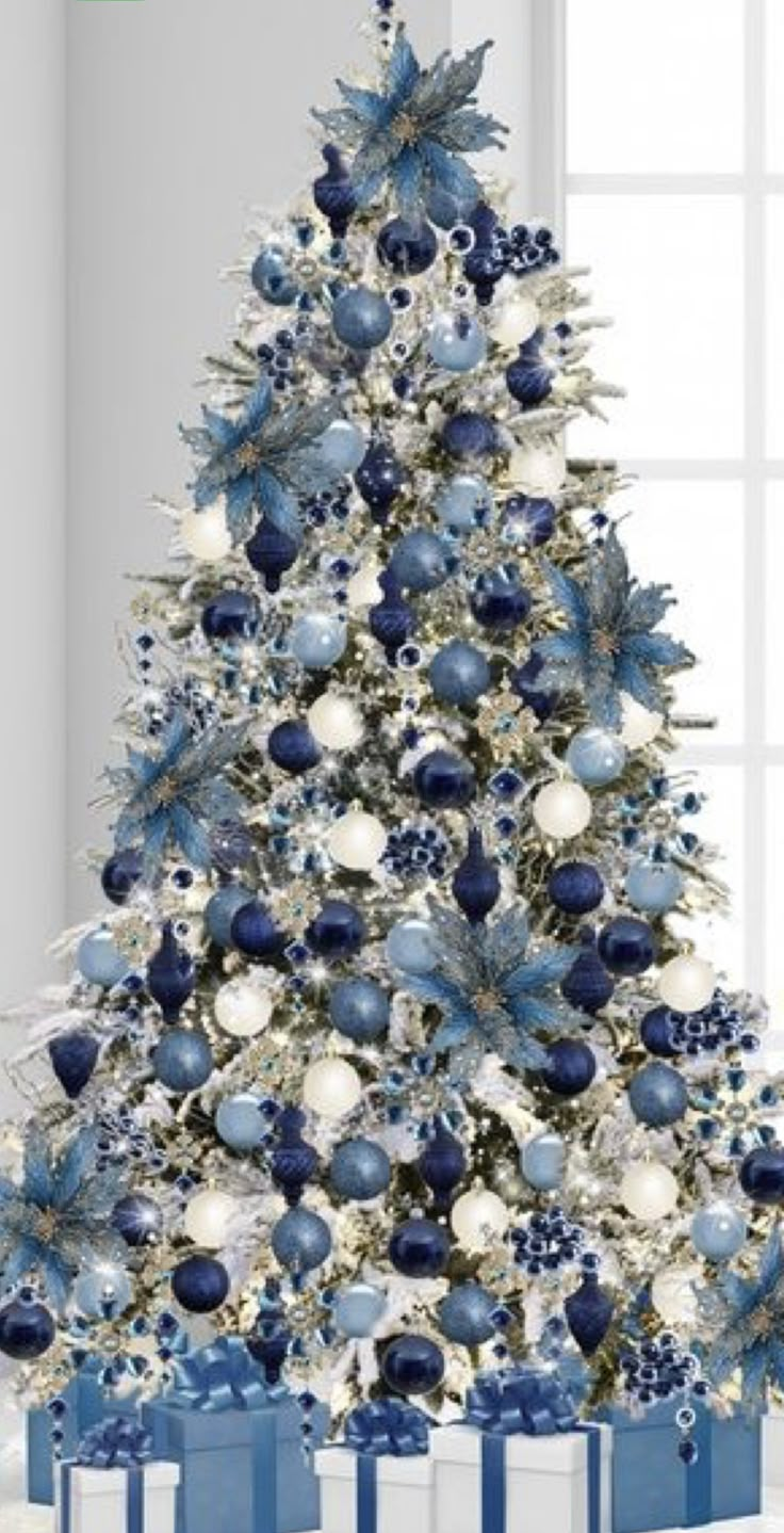 a christmas tree with blue and white ornaments