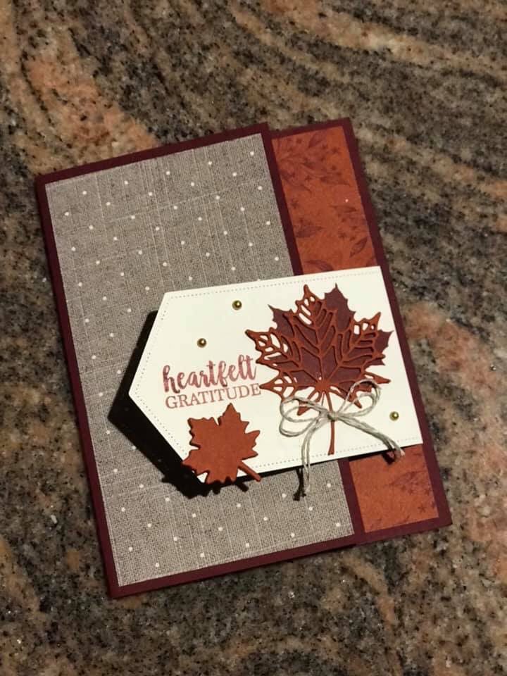 a close up of a card with a leaf on it