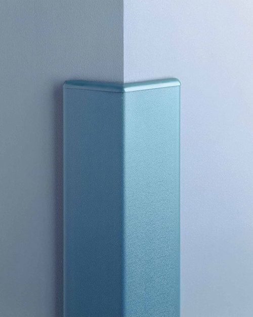 a blue vase sitting on top of a white and gray wall next to a light grey wall