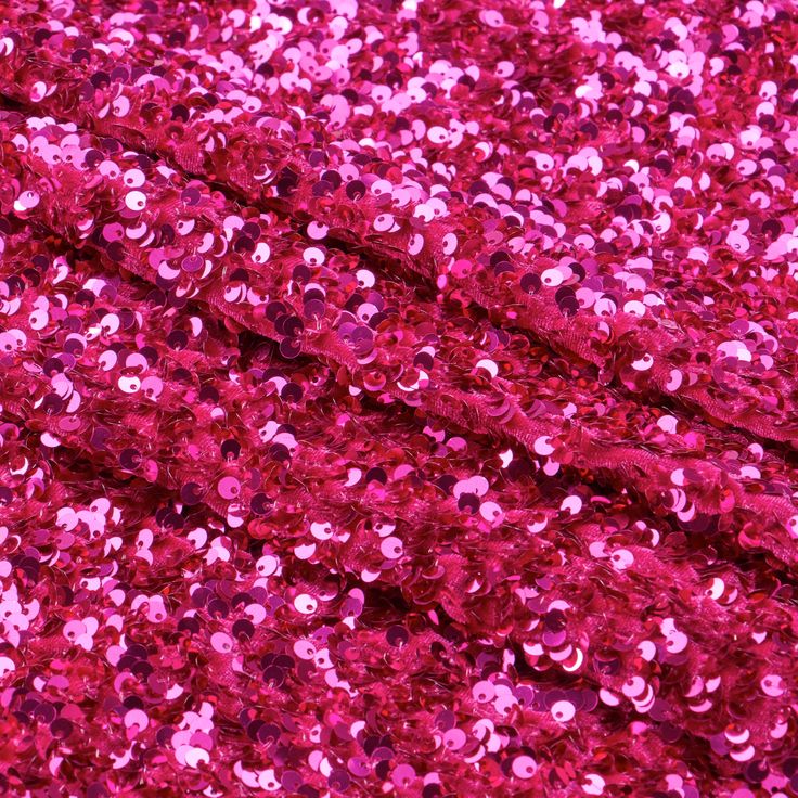 pink sequins are scattered on top of each other