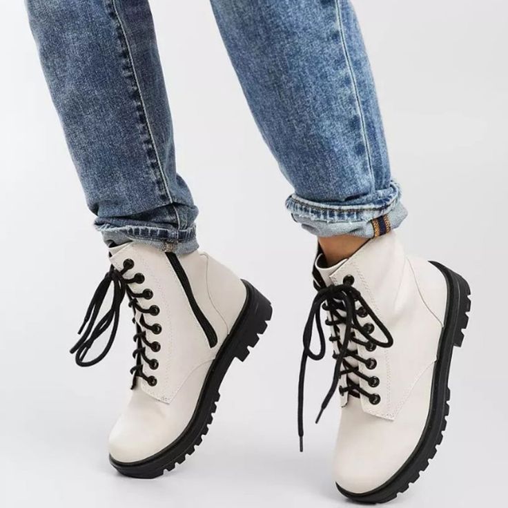 The Time Is Here To Show Off Your Style Game In These Off White Combat Boots. This Ankle Boot Silhouette Features Smooth And Sleek Faux Leather That Shapes A Rounded Toe And A Lace-Up Upper (With Matching Hardware) Atop A Thick Platform Lug Sole. A Back Pull Tab Completes This Edgy Yet Trendy Look! ** Bundle Up To Get An Additional 10% Discount ** Condition: Brand New Color: Off White Heel Height: 1.5" (Approximately) Fits: True To Size (M) White Martin Boots For Spring, White High Ankle Martin Boots For Spring, White Round Toe Martin Boots For Fall, White Martin Boots With Round Toe For Fall, Fall White Martin Boots With Round Toe, Casual White Martin Boots For Winter, Spring Combat Boots With Laces And Round Toe, Trendy White Martin Boots With Flat Heel, Casual White High-top Booties