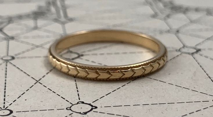 Lovely, engraved, vintage, solid 14K, gold band with crisp chevron engraving and  fine milgrain. Stamped 14K  Hallmark stamp for the Bridal Ring Co, Inc., a New York, NY based company from the 1950s. A MESSAGE ABOUT MY CURATED ANTIQUE & VINTAGE PIECES For antique and vintage items such as this one, keep in mind that there may be expected wear, due to the age of the piece. I'm a collector. I am not a gemologist or goldsmith. I describe each piece to the best of my knowledge. Be sure to carefully review the images before making a purchase. If you have ANY questions or concerns about a piece, DO contact me. My goal is for you to be confident and happy with your purchase. READ BELOW FOR MY SHOP'S SHIPPING/LAYAWAY/RETURN POLICIES AND PROCEDURES: SHIPPING: We ship all items fully insured with si Classic White Gold Engraved Ring For Ceremonial Occasions, Timeless Engraved Ring With Decorative Band For Formal Occasions, Classic White Gold Engraved Ceremonial Ring, Classic White Gold Ceremonial Engraved Ring, Engraved Yellow Gold Bands For Formal Occasions, Classic Ceremonial White Gold Engraved Ring, Classic Gold Engraved Ring For Ceremonial Use, Timeless Engraved Ring With Decorative Band, Elegant Engraved Yellow Gold Band