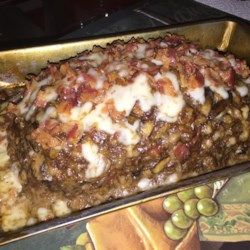 a casserole dish with meat and cheese on top