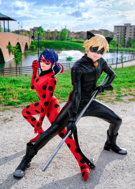 two people dressed as ladybug and catwoman