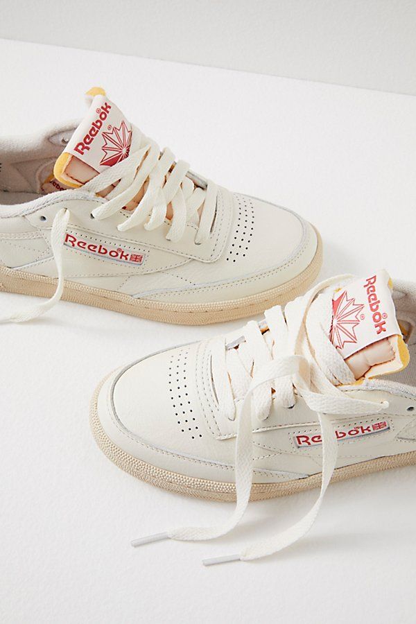 A classic court style infused with retro flair, complete with leather uppers, terry lining, and faded rubber outsoles. **Features:** Low-top style, leather uppers, perforated toe box, removable EVA foam sockliner die-cut EVA midsole, durable rubber outsole, lace-up closure, logo details, terry lining **Why We | Reebok Club C 85 Vintage Sneakers at Free People in White, Size: US 8 90s Style Shoes, Going Out Sneakers, Cool Sneakers Women, 80s Trainers, Back To School Sneakers, Affordable Sneakers, Astro Dust, Slip On Sneakers Women, 80s Sneakers