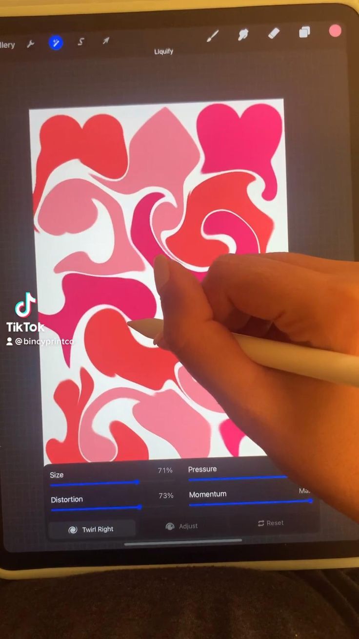 someone is drawing on an ipad screen with a pencil