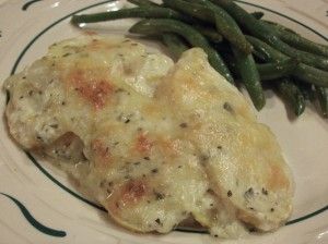 a white plate topped with chicken and green beans