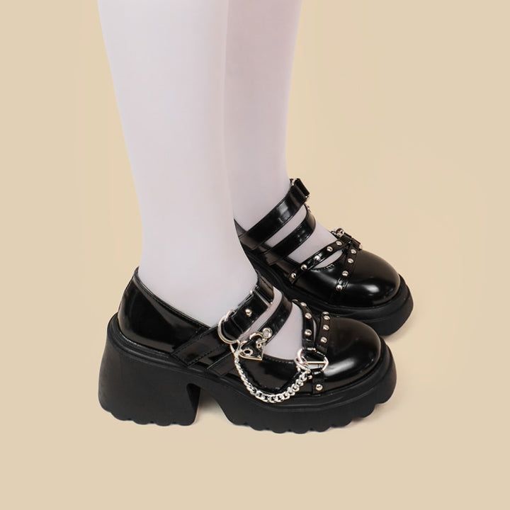 These Gothic Lolita High Heel Black Shoes offer a stylish and timeless look. Crafted with quality materials, they feature a classic silhouette perfect for formal and casual occasions. Their comfortable fit and chic design comes together to create a fashionable piece that is sure to make a statement. Black Punk Heels With Closed Toe, Black Punk Closed Toe Heels, Black Closed Toe Punk Heels, Alternative Style Black Closed Toe Heels, Black Closed Toe Alternative Heels, Punk Heels With Pointed Toe For Concert, Punk Style Pointed Toe Heels For Concerts, Black Gothic Ankle Strap Heels, Black Gothic Heels With Closed Toe