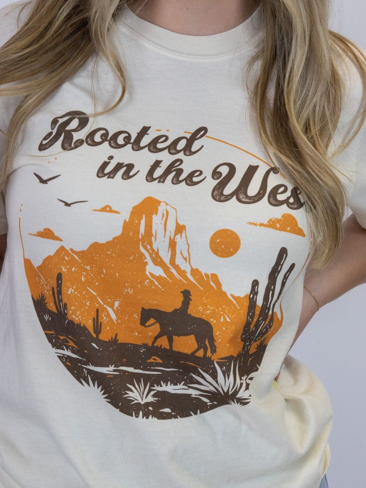 Ride into style with this wild west tee. Crafted from soft ring-spun cotton, this tee ensures comfort without compromising on durability. With a bold western graphic, it captures the essence of rugged, frontier spirit. Perfect for everyday wear, this heavyweight tee blends timeless comfort with iconic western flair, making it a standout piece in any wardrobe. Congo Kinshasa, Wild West, Ethiopia, Dominican Republic, Guinea Bissau, Kuwait, Honduras, Caribbean Netherlands, Ghana