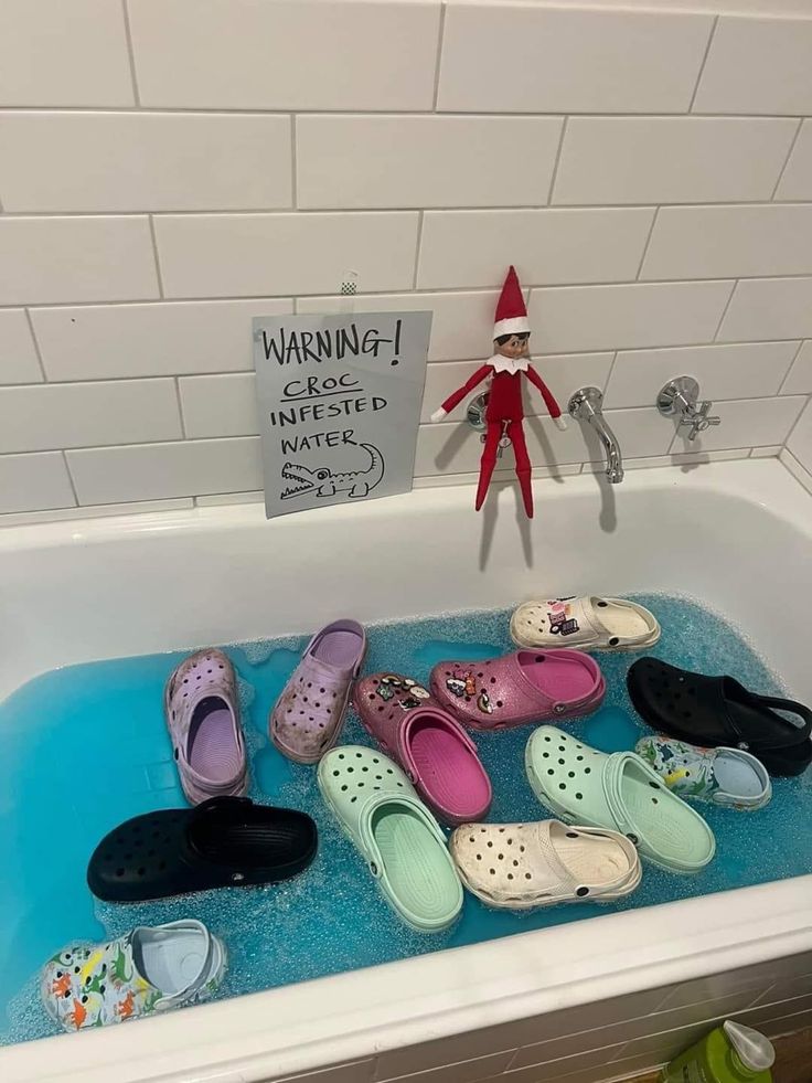 the elf in the bathroom is taking a bath with his feet up on the tub